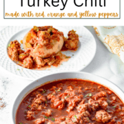 A fluffy baked potato sliced open and stuffed with thick, colorful turkey chili, topped with fresh jalapeño slices and dairy-free sour cream.