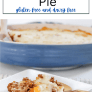 A blue casserole dish filled with savory ground beef and carrots, topped with a thick, golden layer of mashed potatoes