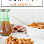 An oval baking dish filled with smooth mashed sweet potatoes topped with a generous layer of crunchy, maple-glazed walnuts and cinnamon.