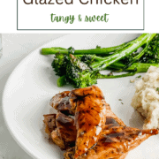 Golden brown chicken tenderloins coated in a dark, glossy maple balsamic glaze in a skillet, garnished with dried herbs.