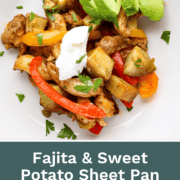 A large sheet pan filled with roasted chicken thigh strips, sliced bell peppers, red onions, and cubed sweet potatoes, all seasoned with smoky fajita spices.